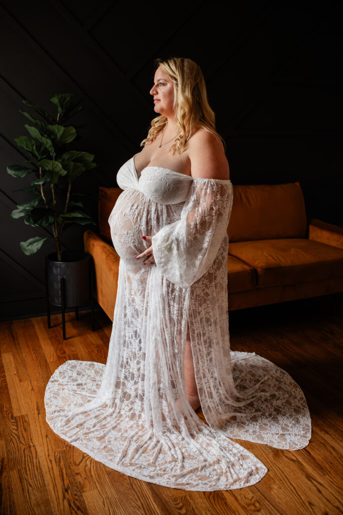 Pregnant mother holding belly during lifestyle maternity session